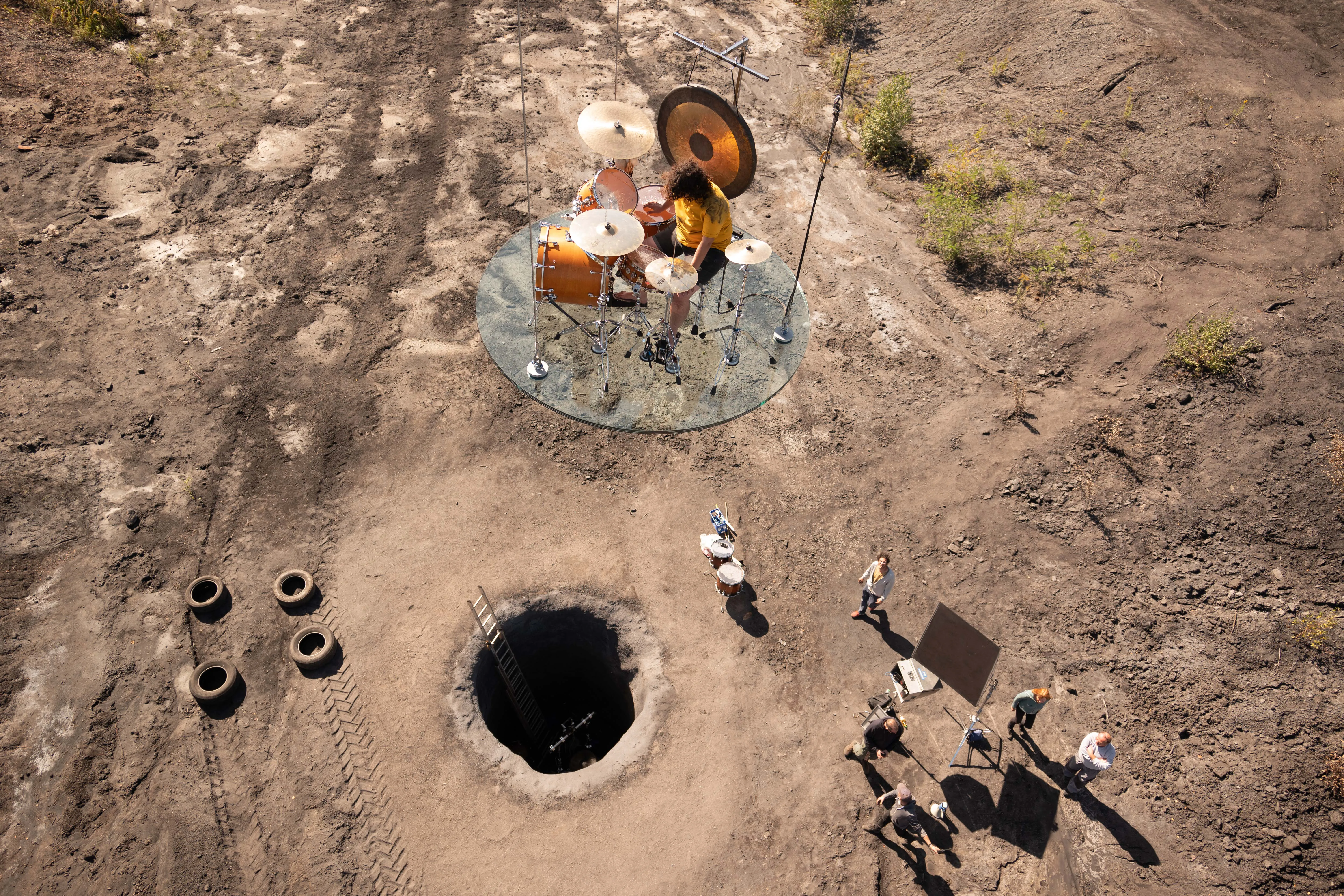 Behind the scenes of the Drummerrsss shoot, capturing Alejandra Levi and the underground pit setup.